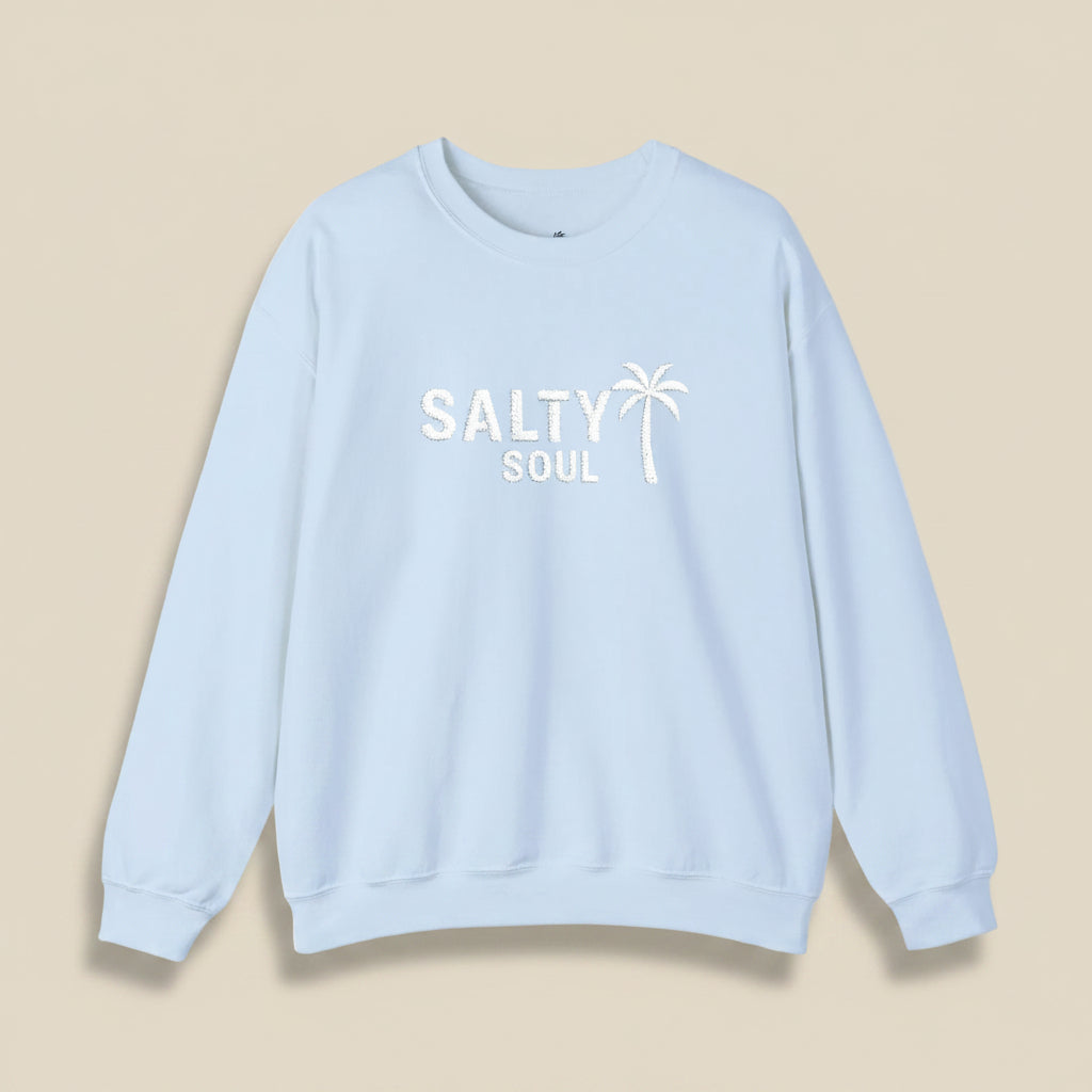 Light blue sweatshirt with 'Salty Soul' text and palm tree graphic on a white background