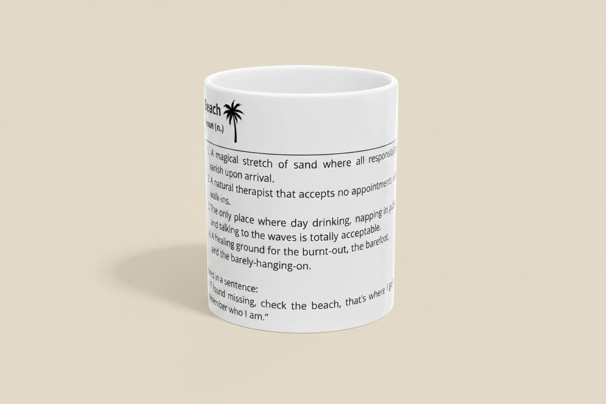 White mug with black text and palm tree design on a white background